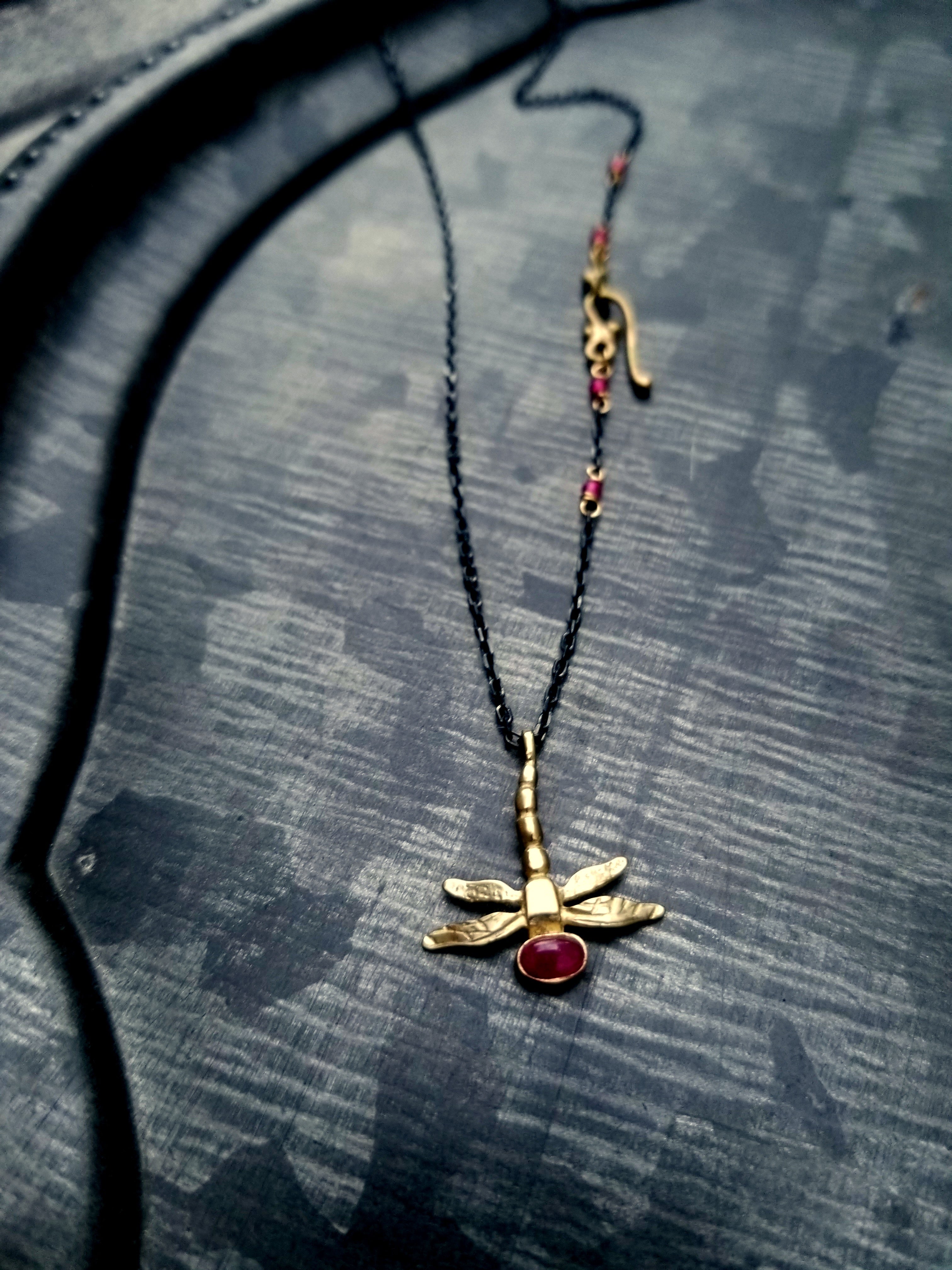 14k Dragonfly, set with Ruby cabochon, on  blackened Sterling Chain, 14k Hook Clasp. ©Teresa de la Guardia, All Rights Reserved 