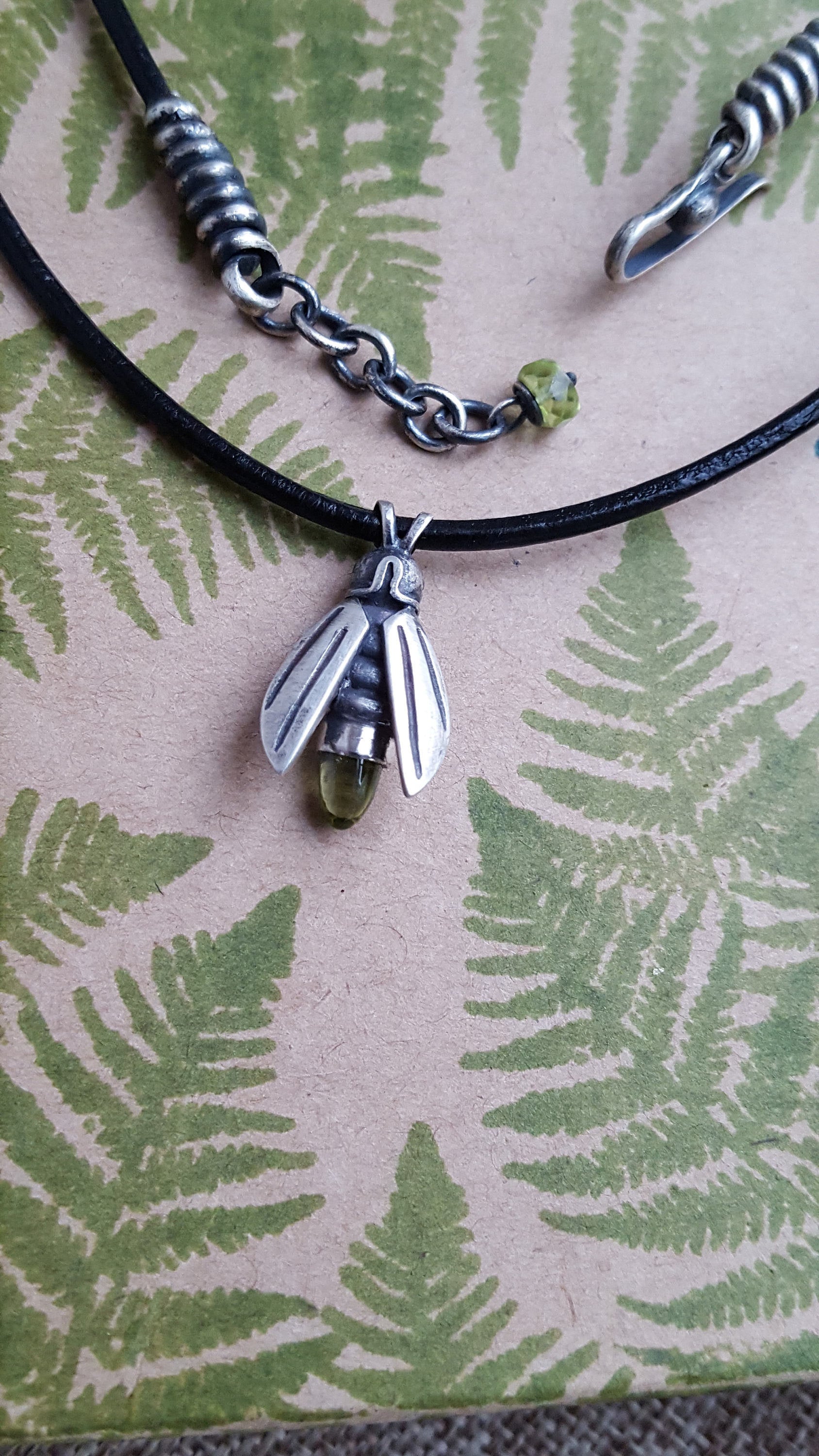 Firefly Amulet on Black Leather, Sterling and Peridot